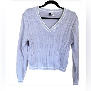 Soft, cable-knit, v-neck sweater with long sleeves. Light purple. Size Small